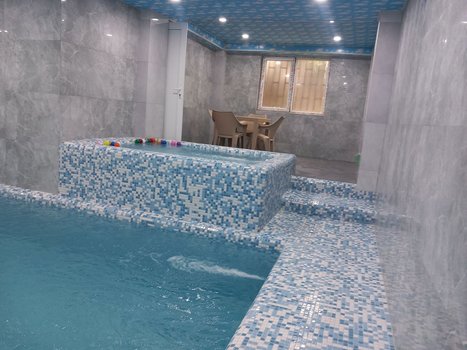 آپارتمان چهارخوابه استخردار آبگرم برهانی - نمایی دیگر از محیط استخر