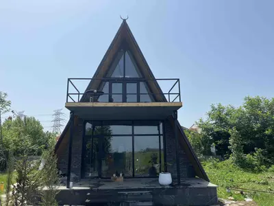 کلبه کلبه سوئیسی شالیز کُتام